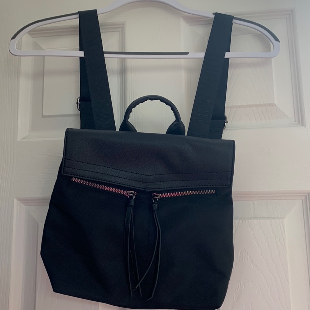 Botkier black backpack purse with front zippered pockets. Brand new with tags.